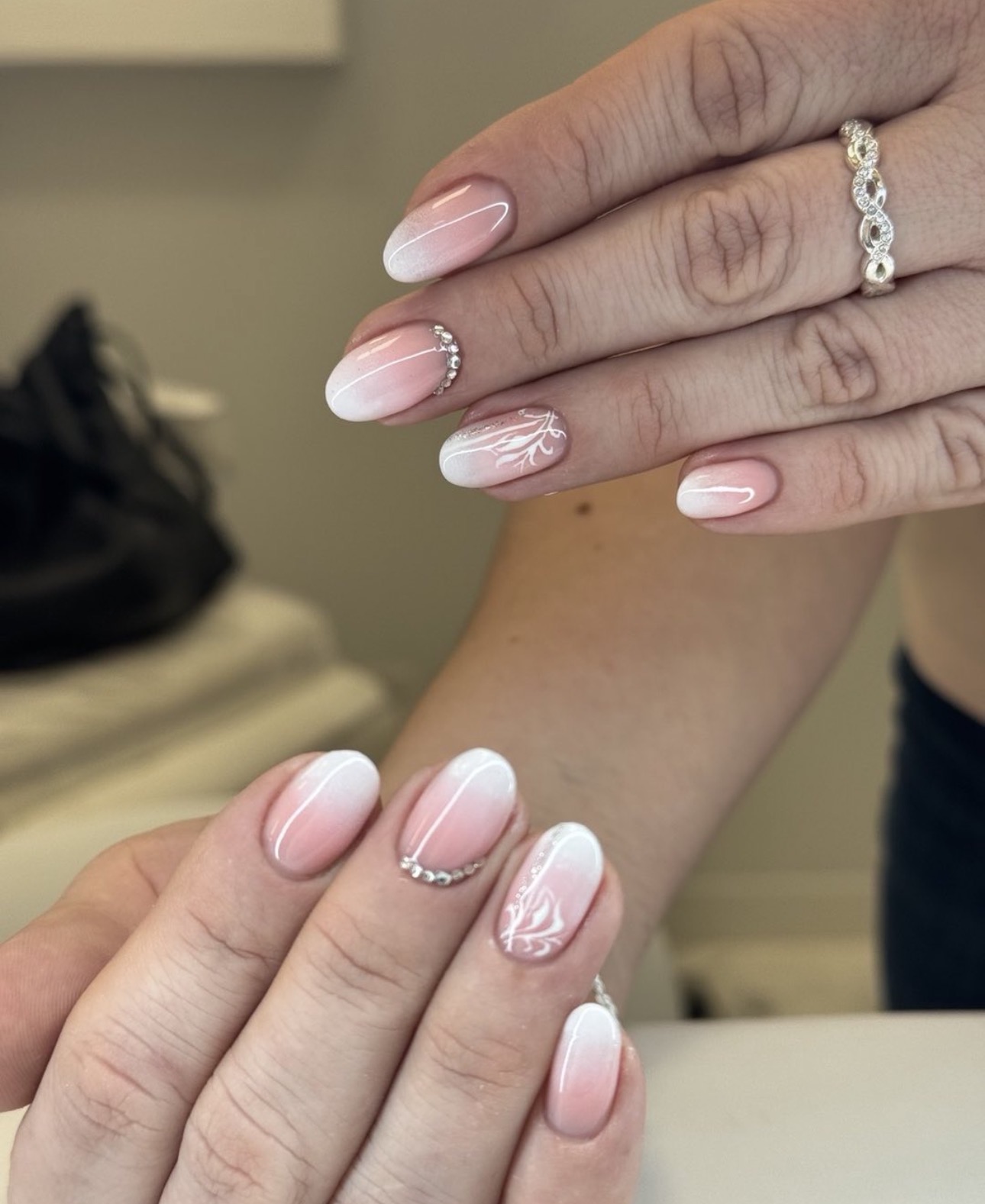 Ombre almond nails with delicate crystal accents